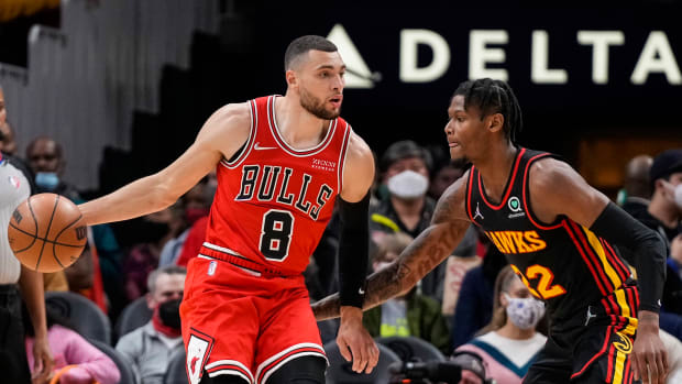 Dec 27, 2021; Atlanta, Georgia, USA; Chicago Bulls guard Zach LaVine (8) controls the ball in front of Atlanta Hawks forward Cam Reddish (22) during the first half at State Farm Arena.